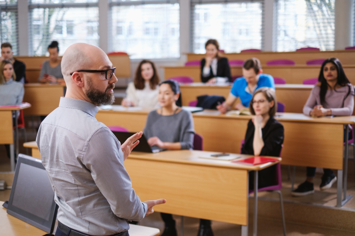 Lecturer and multinational group of students in an auditorium