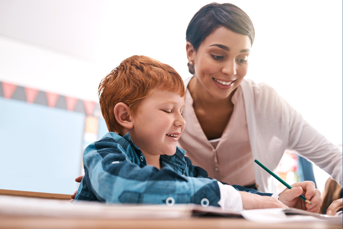 woman teaching a children redhead student