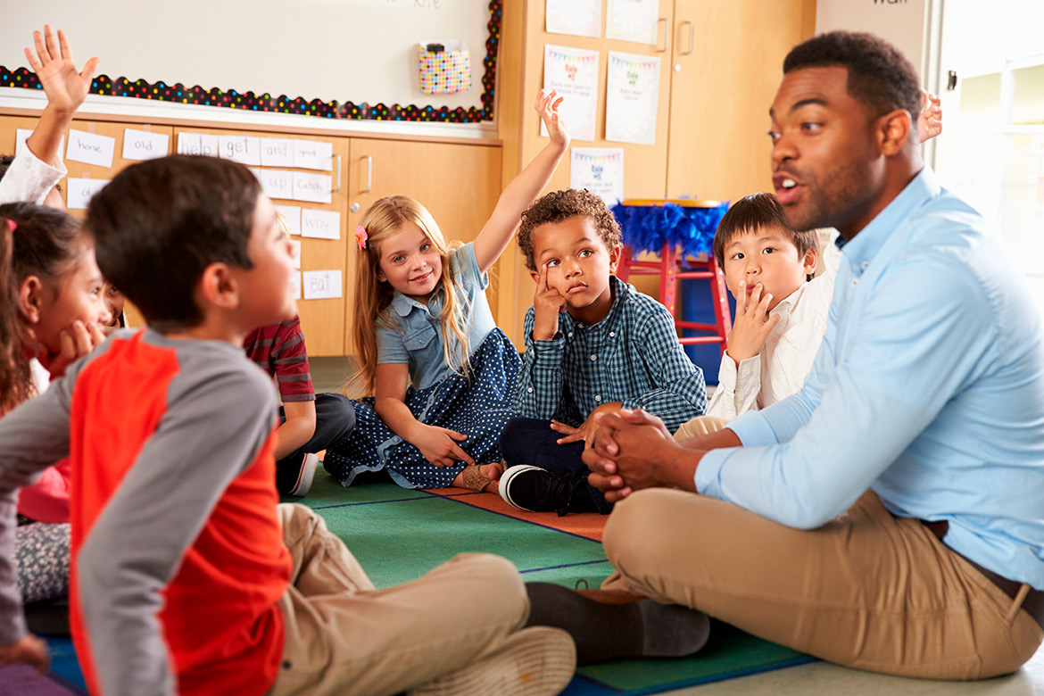 teacher talking and doing class with kids. 